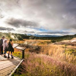 a man that is standing in the grass
