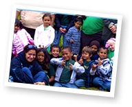 a group of people posing for a photo in front of a television